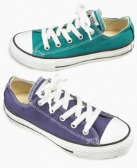 Classic cool. These versatile Chuck Taylor sneakers from Converse add a comfortable hint of cool to their casual style.