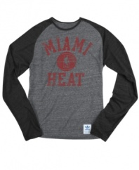 Rush the court! Be a part of the team victory with this Miami Heat NBA raglan shirt from adidas.