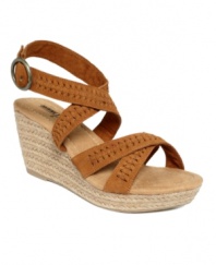 Swing into spring: The Haley wedge sandals by Minnetonka Moccasin feature authentic yet trendy details to add a natural air to your look. A classic espadrille wedge tops off a braided suede silhouette.