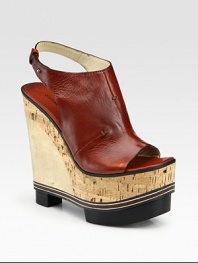 Elevated by a cork and wooden wedge, this slip-on leather mule has a uniquely crafted platform and an adjustable slingback strap. Cork and wooden heel, 6 (150mm)Cork and wooden platform, 2½ (65mm)Compares to a 3½ heel (90mm)Leather upperLeather lining and solePadded insoleMade in ItalyOUR FIT MODEL RECOMMENDS ordering one size up as this style runs small. 