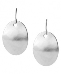 Round out your look. A distinctive hammered design stands out on these shimmering disc earrings from Kenneth Cole New York. Strung from a silver tone ear wire, they're crafted in silver tone mixed metal. Approximate drop: 1-3/4 inches.
