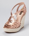 A metallic masterpiece from Joan & David--the Dreena sandals boast knotted details and a raffia-wrapped wedge.