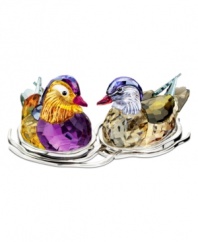 A striking pair, the Topaz Mandarin duck figurines nest together in a bed of silvertone metal. Exquisite faceted detail and vibrant colors in Swarovski crystal capture the natural beautiful of the real birds.