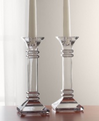 A modern take on a classic design, these crystal candleholders feature sleek lines and sharp, precise edges that converge on a substantial base. In clear lead crystal.