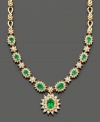 Establish everlasting elegance with this royalty-inspired necklace by Effy Collection. Filled with lovely detail, this necklace features oval and round-cut emeralds (3-3/8 ct. t.w.) and round-cut diamonds (2-1/3 ct. t.w.) set in 14k gold. Approximate length: 16 inches. Approximate drop: 1 inch.
