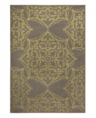 A classic medallion design is brought to life in lush hues of green and grey in this Zanzibar area rug from Sphinx. Its streamlined, low-cut pile and durable construction offer a handsome, lasting finish to any room. (Clearance)