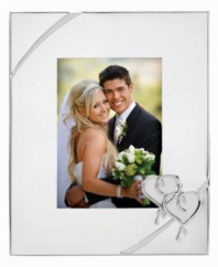 Preserve a cherished moment of your own or treat your favorite newlyweds to the True Love picture frame. Interlocking hearts adorn elegant silver plate, a beautiful showcase for wedding or honeymoon photos. Qualifies for Rebate