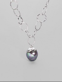 An open link chain of hammered sterling silver is highlighted by an iridiscent organic grey pearl drop. 22mm man-made pearl Sterling silver Length, about 17 Lobster clasp with charm detail Made in Spain