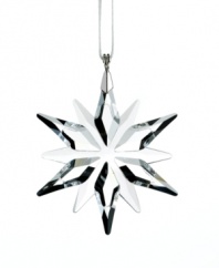 This exquisite clear crystal ornament adds a delicate touch of sparkle to your festive decorations. It comes on a white satin ribbon and the silhouette reflects the Christmas Ornament Annual Edition 2011. For even more impact, hang several Little Stars together on your tree or in a window.