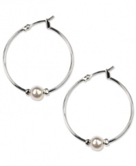 Perfectly polished. These Anne Klein classic hoop earrings feature added elegance with white plastic pearls and glass stone accents. Crafted in imitation rhodium-plated mixed metal. Approximate diameter: 1-1/4 inches.
