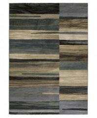 Brilliant tones of bone, tan, silver, teal and sage scatter across this Taylor Synchrony area rug from Couristan, creating the ultimate floor accent for complementing industrial and mid-century decors. Wilton-woven for unparalleled depth, texture and quality.