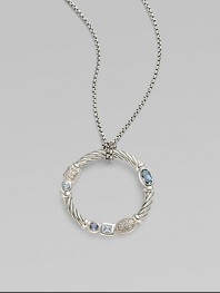 From the Confetti Collection. A wreath-shaped cable pendant, luxuriously set with pavé diamonds and other gemstones, dangles from a sterling silver chain. Diamonds, 0.05 tcw Blue topaz and iolite Sterling silver Chain length, about 16 Pendant diameter, about 1 Lobster clasp Made in USA