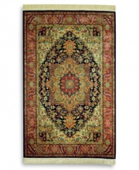 A beautiful example of traditional heriz designs, this rug features a bold navy center medallion surrounded by intricate florals in lighter shades of red and green. The combination of graceful lines and geometric shapes creates an exquisitely balanced pattern. Each color is individually skein-dyed for jewel-tone clarity. A patented wash process creates a vintage finish faithful to the craftsmanship of the original. Woven in the USA of premium fully worsted New Zealand wool.