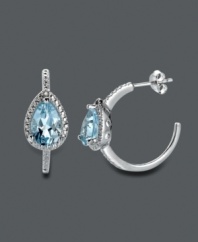 A traditional hoop earring with an extra touch of shine. Victoria Townsend's elegant design highlights a pear-cut blue topaz (4 ct. t.w.) surrounded by sparkling diamond accents. Crafted in sterling silver. Approximate diameter: 7/8 inch.