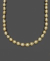 Like individual nuggets of gold, these pearls feature a unique, asymmetrical texture and design. Belle de Mer's rich necklace features golden cultured south sea pearls (9-11 mm) set in 14k gold. Approximate length: 18 inches.