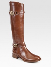 An equestrian-inspired style of polished leather, with the signature medallion and adjustable wrap-around strap. Stacked heel, 1¼ (30mm)Shaft, 17Leg circumference, 13¾Leather upperRubber solePadded insoleImportedOUR FIT MODEL RECOMMENDS ordering one half size up as this style runs small. 