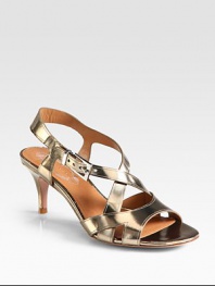 A practical heel lifts this strappy summer essential of lustrous metallic leather. Self-covered heel, 2¾ (70mm)Metallic leather upperAdjustable ankle strapLeather lining and solePadded insoleImportedOUR FIT MODEL RECOMMENDS ordering true size. 