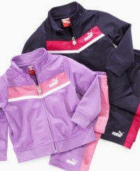 Track star style. Keep her warmed up when she's on the go in this cute, cozy look from Puma, with matching jacket and pants.