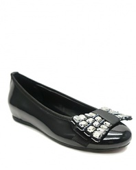 A sleek ballet flat is updated with an oversized rhinestone-encrusted bow, for a glamorous look guaranteed to wow.