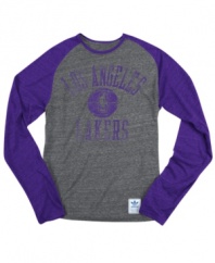 Rush the court! Be a part of the team victory with this Los Angeles Lakers NBA raglan shirt from adidas.