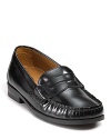 Cole Haan creates high quality leather penny loafers with Nike Air technology for classic comfort and timeless style.