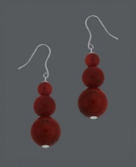 Get seaside style in an instant with the featured color of summer. Drop earrings by Avalonia Road feature three, graduated coral beads set in sterling silver. Approximate drop: 1-1/2 inches.