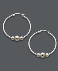 Trendy two tone. Giani Bernini's versatile hoop earrings feature a sterling silver setting with beaded accents in sterling silver and 24k gold over sterling silver. Approximate diameter: 1-1/5 inches.