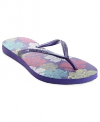 Pretty florals and bright colors are the picture of summer. The slim Allegra thong sandals by Havaianas feature a metallic thong strap that adds extra shine.