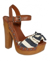 The ultimate summer sandals. Paired with jean shorts or a flirty skirt, the Terrii sandals by Jessica Simpson have it all with nail head trim and a chunky, wooden platform.