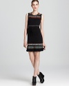 Fringe lends flair to this zig-zag knit Nanette Lepore dress with cinched drawstring waist.