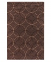Interlocking circles create a lush geometric pattern that help shape any room on this rich brown area rug from Surya. Hand-tufted from poly-acrylic fibers that provide luxurious softness without shedding, this rug adds a striking, easy-maintenance accent to any living space.