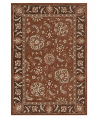 A beautifully detailed motif teeming with lush botanicals enlivens your home with old-world grandeur. Hand tufted in densely woven polyester and acrylic, this plush area rug from Dalyn will maintain its subtle coloration and rich texture for years to come.