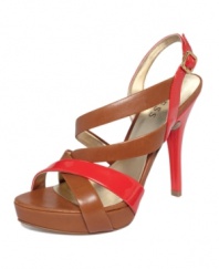 A shiny twist on a sophisticated style. Patent color blocking brightens up the classic silhouette of the strappy Dabrial2 platform sandals by GUESS.