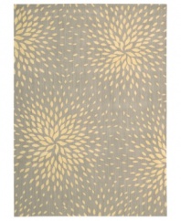 A chic starburst pattern adorns this stylish rug from the Capri collection, offering a unique focal point for any room. Woven of a blend of fine wool with Nourison's signature light-reflecting Luxcelle™ fibers, the rug's soft grey shade and luminous appearance complement a range of decors. (Clearance)