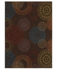 Featuring an iconic design that recalls American mid-century modern motifs, this casual Karastan rug is covered in bold mandala-like medallions in beautiful hushed hues. Woven from premium New Zealand wool, this rug offers alluring style and a blissfully soft feel underfoot.