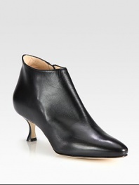 Sculpted silhouette of rich Italian leather heightened by a petite, self-covered heel. Self-covered heel, 2½ (65mm)Leather upperSide zipLeather lining and solePadded insoleMade in Italy