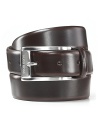 Sleek brown dress belt with silvertone, brushed buckle. Hugo Boss engraved on buckle.