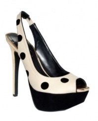 Add a little playfulness to your pumps. Graphic polka dots adorn the sexy silhouette of the Halie platform pumps by Jessica Simpson.