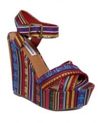 Electrify your legs with the Winonna sandals by Steve Madden. A towering wedge heel covered in multicolored fabric shows that you're all about taking risks.