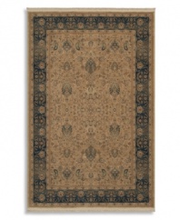 Inspired by Persian pieces from the early 20th century, this all-wool Karastan rug is a perfect combination of depth, detail and color. An intricate pattern of stylized florals plays against a neutral ground, finished with an elegant ombre effect for that world-worn antique look.