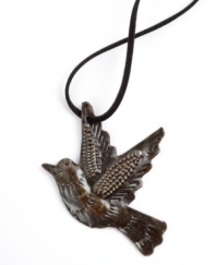 Haiti's creative artisans find beauty in a simple steel barrel, transforming the raw metal into this rustic bird pendant. Carved and embossed feathers add personality for a necklace that's decidedly one of a kind. With a faux suede cord.