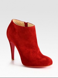 Lifted by a self-covered heel, soft suede shapes a sophisticated, side-zip ankle boot. Self-covered heel, 4 (100mm)Suede upperSide zipperLeather liningSignature red leather solePadded insoleMade in ItalyOUR FIT MODEL RECOMMENDS ordering true size. 