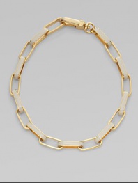 A chunky, statement piece with wide, enamal accented links. Plated brassEnamelLength, about 18¾Large lobster clasp closureImported 