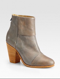 Glimmering leather style with a chunky heel, back zipper and unique fold-over detail. Stacked heel, 3½ (90mm)Leather upperBack zipperLeather lining and solePadded insoleImportedOUR FIT MODEL RECOMMENDS ordering true whole size; ½ sizes should order the next whole size up.