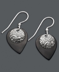 Embrace the boho-chic styles of Jody Coyote. This free-spirited pair of earrings feature teardrop-shaped black patina bronze and a circular sterling silver charm. Approximate drop: 1-1/8 inches.