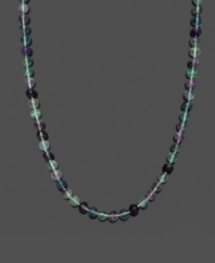 A fresh mix of spring color. Necklace features green and purple fluorite beads (8-9 mm) with a 14k gold clasp. Approximate length: 18 inches.