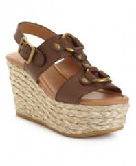 Show off with Lucky Brand's reinterpretation of a classic wedge: the Reba. Metal hardware adorns the chunky straps set atop a unique rattan-covered platform.