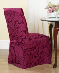 An effortless update and perfect furniture protector, the printed Scroll dining room chair cover from Sure Fit features a draped skirt with back ties for a sleek fit over any style furniture.