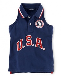 A red, white and blue design finished with U.S.A. patching and embroidered emblems gives a preppy all-American look to the classic sleeveless polo, celebrating Team USA's participation in the 2012 Olympics.