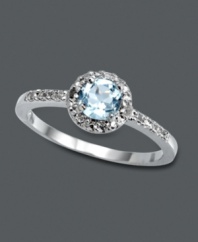 Subtle, simple, and sublime. This elegant Victoria Townsend style features a round-cut blue topaz gemstone (1/2 ct. t.w.) encircled by sparkling diamond accents. Crafted in sterling silver. Size 7.